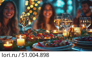 Friends celebrate the festive season together, enjoying a beautifully arranged dinner with drinks and warm candlelight in a cozy atmosphere. Стоковое AI-видео, аниматор Данила Большаков / Фотобанк Лори