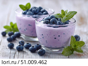 Fresh Berry Trifle in Glasses. Dessert with Blueberries and Whipped Cream. Layered Yogurt with Berry Fruits. Berry Pudding Glass Jars. Food Marketing, Recipe Design. Colorful Sweet Treat. Fruity Quark. Стоковое AI-изображение, AI-художник Марина Демидюк / Фотобанк Лори