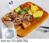 Roasted lamb leg served with grilled organic vegetable and peppe closeup. Стоковое фото, фотограф Яков Филимонов / Фотобанк Лори