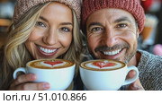 A vibrant couple shares smiles as they hold large cups of latte art in a cozy café, creating a warm atmosphere on a cold day. Стоковое AI-видео, аниматор Данила Большаков / Фотобанк Лори