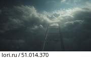 Ladder ascending through clouds under a dramatic sky with soft light illuminating the scene. Стоковое AI-видео, аниматор Сергей Толмачёв / Фотобанк Лори