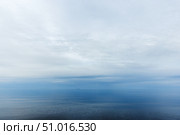 Serene Ocean Horizon Underneath Expansive Cloudy Sky. Стоковое фото, фотограф EugeneSergeev / Фотобанк Лори