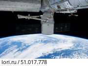 SpaceX Dragon during its docking with the International Space Station. Стоковое фото, фотограф Stocktrek Images, Inc. / ТАСС / Фотобанк Лори