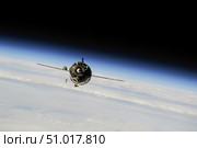 The Soyuz TMA-10M spacecraft in orbit above Earth. Стоковое фото, фотограф Stocktrek Images, Inc. / ТАСС / Фотобанк Лори