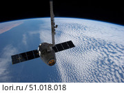 The SpaceX Dragon cargo craft prior to being released from the Canadarm2. Стоковое фото, фотограф Stocktrek Images, Inc. / ТАСС / Фотобанк Лори