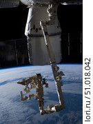 The SpaceX Dragon commercial cargo craft berthed to the ISS. Стоковое фото, фотограф Stocktrek Images, Inc. / ТАСС / Фотобанк Лори