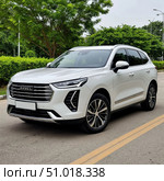 Автомобиль  Haval Jolion. Редакционное AI-изображение, AI-художник Анатолий Володин / Фотобанк Лори