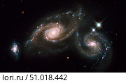 A triplet of galaxies known as Arp 274. Стоковое фото, фотограф Stocktrek Images, Inc. / ТАСС / Фотобанк Лори