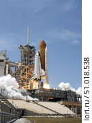 Space shuttle Atlantis' twin solid rocket boosters ignite to propel the spacecraft off Kennedy Space Center's Launch Pad 39A. Стоковое фото, фотограф Stocktrek Images, Inc. / ТАСС / Фотобанк Лори