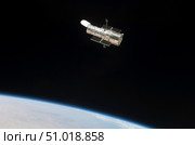 The Hubble Space Telescope in orbit above Earth. Стоковое фото, фотограф Stocktrek Images, Inc. / ТАСС / Фотобанк Лори
