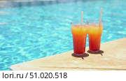 Fruit cocktail at the pool on vacation. Стоковое видео, видеограф Igor Skripachev / Фотобанк Лори
