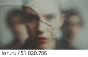 Exploring the emotions behind shattered reflections in a dimly lit setting. Стоковое AI-видео, аниматор Сергей Толмачёв / Фотобанк Лори
