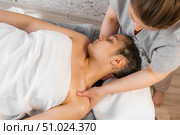 Massage with woman in spa for wellness, cosmetics treatment. Relax, peace with female customer and hands of therapist for physical therapy, salon. Стоковое фото, фотограф Владислав Тригуб / Фотобанк Лори