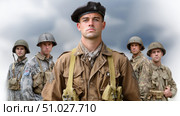 British paratrooper posing with fellow soldiers under cloudy sky. Стоковое AI-изображение, AI-художник Юрий Поздников / Фотобанк Лори
