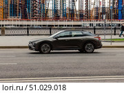 Citroen C5 X car moving on the street. Estate vehicle driving along street in city with blurred background. Редакционное фото, фотограф Константин Григорьев / Фотобанк Лори