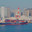 Tokyo, Japan - Oct 13 2024, 4k, panoramic sea view of Tokyo cargo port, docks with cranes and containers and a CMA CGM dry cargo ship loading, with buildings on background, at daytime, Tokyo, Japan. Редакционное видео, видеограф Сергей Богомяко / Фотобанк Лори