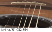 Acoustic guitar strings vibrating, Shot on super slow motion camera 1500 fps. Стоковое видео, видеограф Андрей Армягов / Фотобанк Лори