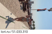 A 50-year-old European woman in a swimsuit is relaxing on a beach in Doha, Стоковое видео, видеограф IRYNA ZAKHARANKA / Фотобанк Лори