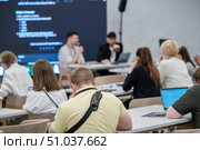 Business seminar with attendees listening to speakers in a professional setting. Стоковое фото, фотограф Антон Гвоздиков / Фотобанк Лори