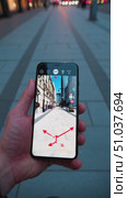 Exploring Augmented Reality Navigation: A User Interacts with a Smartphone Displaying Directional Arrows Over a City Walkway in Urban Environment. Стоковое AI-видео, аниматор Владимир Федоров / Фотобанк Лори