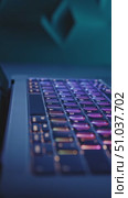 Captivating Close-Up of a Laptop Keyboard Illuminated with Vibrant Colors, Showcasing Modern Technology and Aesthetic Design in an Enigmatic Atmosphere. Стоковое AI-видео, аниматор Владимир Федоров / Фотобанк Лори