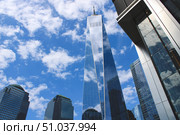 Upward view of a wonderful building surrounded by modern glass skyscrapers. Стоковое фото, фотограф Виктор Ветошкин / Фотобанк Лори