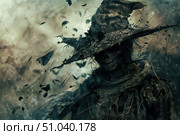 Spooky scarecrow wearing wizard hat standing in windy field with flying butterflies and crows. Стоковое AI-изображение, AI-художник Иван Рябоконь / Фотобанк Лори