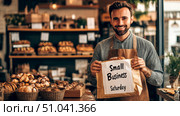 Happy shop owner supporting small business saturday in cozy bakery setting. Стоковое AI-изображение, AI-художник Сергей Бирюков / Фотобанк Лори