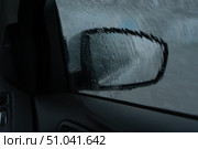 Rearview mirror of a dark gray SUV in rainy weather, drops of water. Стоковое фото, фотограф ~✿Eлена Челышева(Кочина)✿~ / Фотобанк Лори
