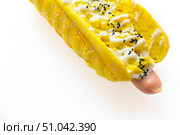 Сосиска с булочкой в сырном соусе с ананасами и семенами тмина на белом фоне. Стоковое фото, фотограф 1Andrey Милкин / Фотобанк Лори