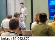 Speaker addressing audience during a professional seminar or conference presentation. Стоковое фото, фотограф Антон Гвоздиков / Фотобанк Лори