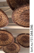 Cozy creative interior of outdoor cafe on beach seacoast. Wooden tables with thatched bamboo chairs and lamps. Summer terrace with rustic wicker chairs nobody. Natural color rattan furniture beach Bar decor rustic straw lamp at the beach patio, bar or shop with blue sky background. Vacation, get away, summer outing concept. Стоковое видео, видеограф Zita Khasanova / Фотобанк Лори