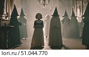 Young girl bravely stands in front of a gathering of witches, looking determined and unafraid. Стоковое AI-видео, аниматор Данила Большаков / Фотобанк Лори
