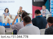 Attendees recording and watching a professional business conference event. Стоковое фото, фотограф Антон Гвоздиков / Фотобанк Лори
