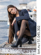 Full length portrait of a young brunette in a formal jacket and black tights. Стоковое фото, фотограф Андрей Аркуша / Фотобанк Лори
