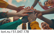 A diverse group of individuals coming together to form a circle and interlock their hands as a symbol of unity and teamwork. Стоковое AI-видео, аниматор Данила Большаков / Фотобанк Лори