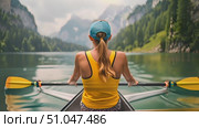 Watch a woman with a yellow shirt skillfully rowing a canoe through calm waters. Стоковое AI-видео, аниматор Данила Большаков / Фотобанк Лори