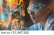 Female scientist in a lab coat and goggles closely examining information displayed on a computer screen in a laboratory setting. Стоковое AI-видео, аниматор Данила Большаков / Фотобанк Лори