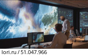 Team analyzes data on large screens in a modern command center during a tech briefing. Стоковое AI-видео, аниматор Сергей Толмачёв / Фотобанк Лори