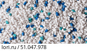 White cat litter round particles surface with small blue colored particles, top view. Granules of pet white-gray litter background. Dog litter texture backdrop with small dots. Flat lay, copy space. Стоковое AI-изображение, AI-художник Марина Демидюк / Фотобанк Лори