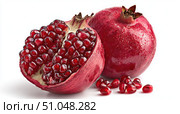 Pomegranates. Pomegranate isolated on a white transparent background. Juicy garnet fruit whole and its half with leaves and details. Piece of pomegranate with seeds. Side view. Freshness and abundance. Стоковое AI-изображение, AI-художник Марина Демидюк / Фотобанк Лори