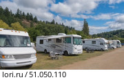 Recreational vehicles parked in nature, embracing the rv lifestyle. Стоковое AI-видео, аниматор Юрий Поздников / Фотобанк Лори
