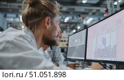 Team collaborates on technical project in modern workspace featuring advanced equipment and innovative design. Стоковое AI-видео, аниматор Сергей Толмачёв / Фотобанк Лори