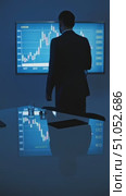 Professional Businessman Analyzing Financial Data on a Digital Screen, Engaged in Market Trends with Graphs and Charts in a Modern Office Environment. Стоковое AI-видео, аниматор Владимир Федоров / Фотобанк Лори