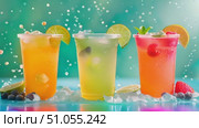 Three colorful chilled drinks garnished with fruit slices, bubbles rising in the sunny backdrop. Стоковое AI-видео, аниматор Данила Большаков / Фотобанк Лори
