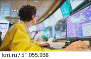 Focused operator manages systems at a control center during a busy shift. Стоковое AI-видео, аниматор Сергей Толмачёв / Фотобанк Лори