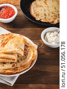 Stack of russian pancakes blini with red caviar, fresh sour cream. Стоковое фото, фотограф Ирина Буракова / Фотобанк Лори