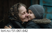 Бабушка с внуком обнимаются. Grandmother and grandson hug each other. Стоковое AI-изображение, AI-художник Смирнова Светлана / Фотобанк Лори