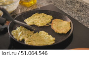 Traditional Belarusian food is fried zucchini marrow squash pancakes hot cake tortillas and garlic mayonnaise sauce. Hearty food, snack, homemade food. Vegetable pancakes decorated with parsley. Стоковое видео, видеограф Яков Филимонов / Фотобанк Лори