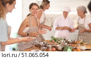 Young woman hold glass of cool white wine in hands and converse with participant at culinary courses. Стоковое видео, видеограф Яков Филимонов / Фотобанк Лори